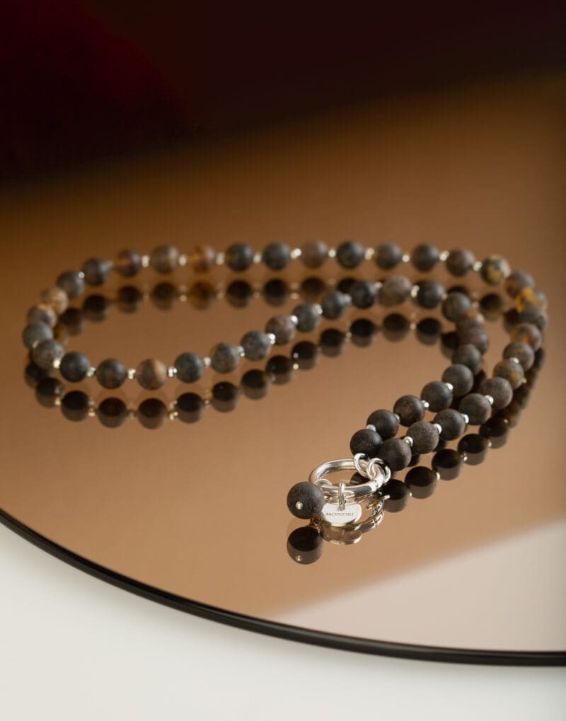 beaded necklace with natural black amber in sterling silver nero by mondri jewelry on the mirror