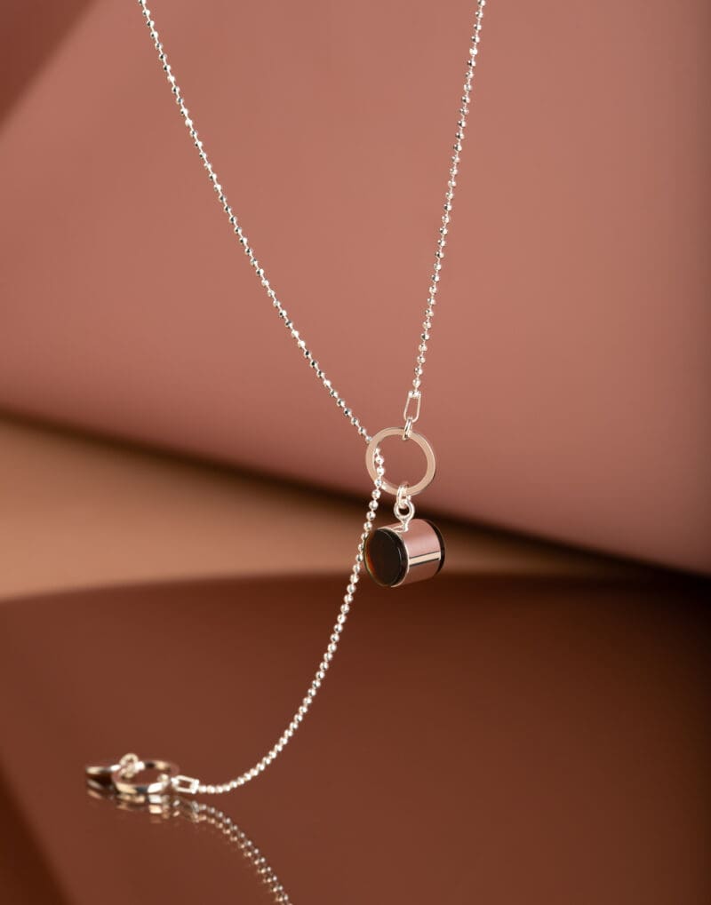 sterling silver modern lariat necklace with dark transparent baltic amber calice mondri jewelry